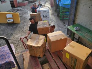 Cuban Southern Baptist Disaster Relief volunteers prepare aid for distribution to the hard-hit island after back-to-back hurricanes and an earthquake.