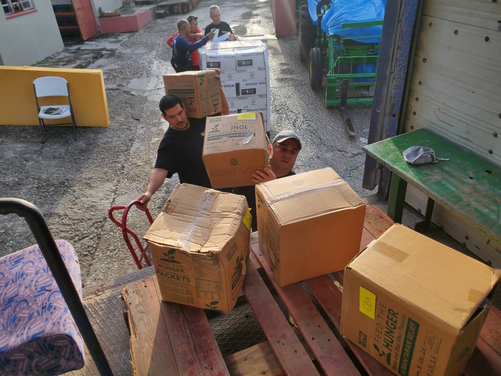 Cuban Southern Baptist Disaster Relief volunteers prepare aid for distribution to the hard-hit island after back-to-back hurricanes and an earthquake.